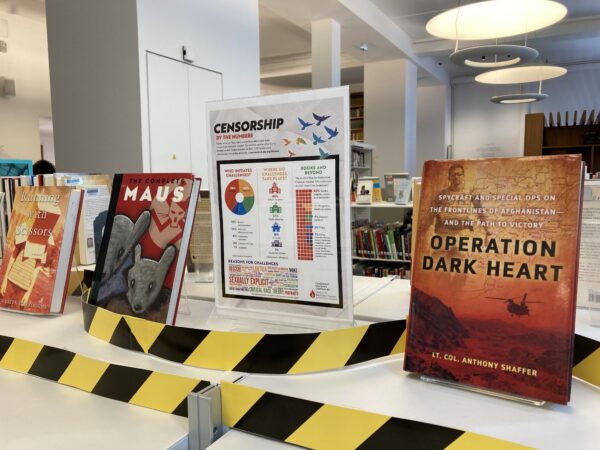 Display of banned/criticized books including Running with Scissors, Maus, and Operation Dark Heart. There is also a datagraphic display of censorship by numbers.
